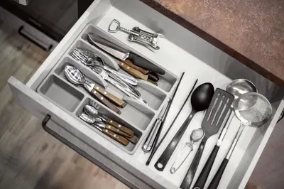 a drawer filled with utensils on a kitchen counter at Cosy Central Apartments by Reside Baltic in Vilnius