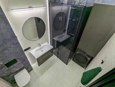 a bathroom with a sink and a shower and a toilet at Rambynas R36 in Panevėžys