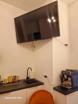 a kitchen with a sink and a microwave at Kaunas Studios - RentA Studio 16 in Kaunas
