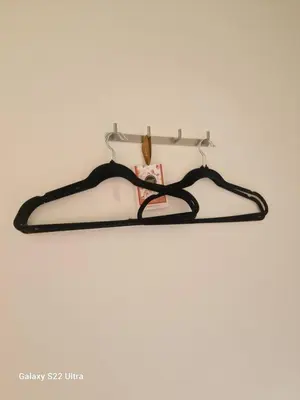 a black hanger hanging on a wall at Kaunas Studios - RentA Studio 16 in Kaunas