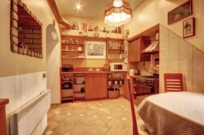 a small kitchen with a table in a room at Sofijos apartamentai Old Town in Vilnius