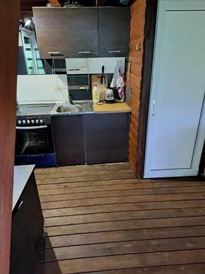 a small kitchen with a sink and a stove at Patrimpo in Magūnai