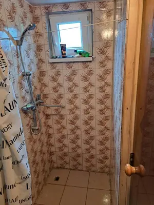 a bathroom with a shower and a window at Patrimpo in Magūnai