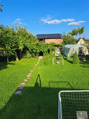 a soccer field with a goal in the grass at Patrimpo in Magūnai