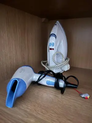 a electric hair dryer is in a box at Old Town Loft in Vilnius