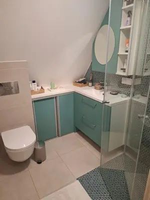 a bathroom with a toilet and a glass shower at Šermukšniai in Rokiškis