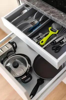 a drawer filled with kitchen utensils in a kitchen at Cozy 1BD with Bathtub Close to Old Town in Vilnius