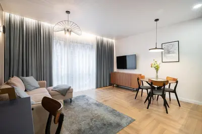 a living room with a couch and a table at Serenity Space in Vilnius by Reside Baltic in Vilnius