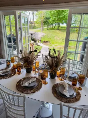 a table with plates of food on top of it at Sodyba Barracuda in Kupščiai