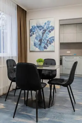 a dining room with a table and chairs at Greimo Apartments in Šiauliai