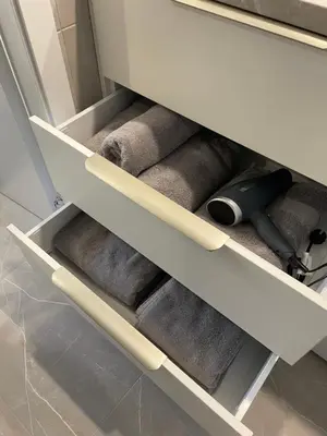 a drawer in a cabinet with some towels at Avia Loft in Kaunas