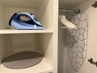 a blue train on a shelf in a closet at Avia Loft in Kaunas