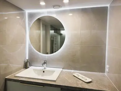 a bathroom with a sink and a mirror at Avia Loft in Kaunas