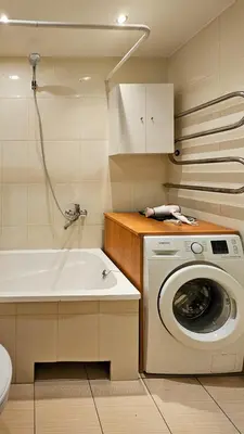 a bathroom with a washing machine and a sink at Green room in Šiauliai