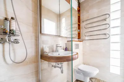 a bathroom with a toilet and a sink at Skroblu 39, cozy apartment in Vilnius