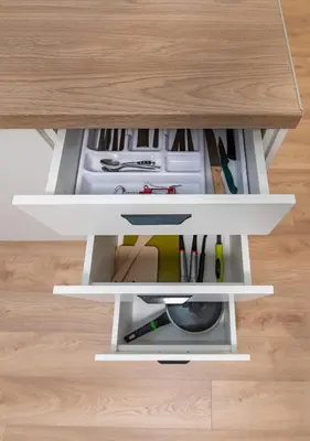 a drawer in a desk with tools in it at Studio Apartment Flora by PoloApartments in Kaunas