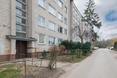 an empty street in front of a brick building at Studio Apartment Flora by PoloApartments in Kaunas