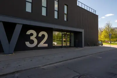 a building with a sign on the side of it at Charlotte loft in Vilnius