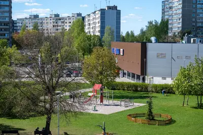 a park with a playground in a city at Charlotte loft in Vilnius