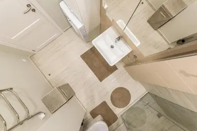 a bathroom with a toilet and a sink at City center apartment, free parking, 149 in Vilnius