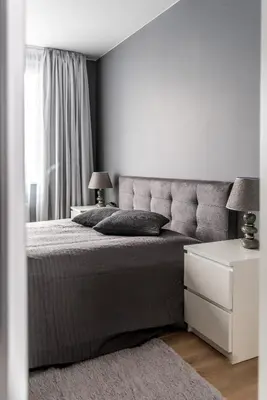 a bedroom with a large bed and a white dresser at City center apartment, free parking, 149 in Vilnius