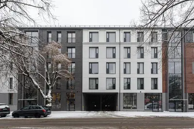 a large white building with a lot of windows at City center, studio, 514 in Vilnius