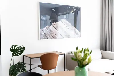 a living room with a couch and a table at City center, 91 with parking in Vilnius