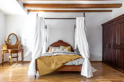 a bedroom with a bed with a mosquito net at Angel House Vilnius, 32 in Vilnius