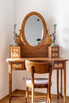 a wooden desk with a mirror and a chair at Angel House Vilnius, 32 in Vilnius