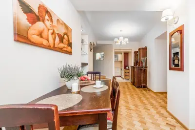 a dining room with a table and chairs at Angel House Vilnius, 32 in Vilnius