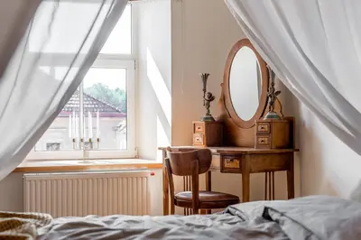 a bedroom with a bed and a mirror and a desk at Angel House Vilnius, 32 in Vilnius
