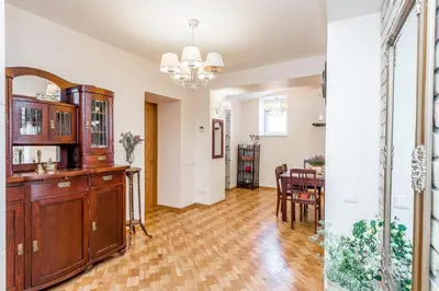 a living room with a table and a dining room at Angel House Vilnius, 32 in Vilnius