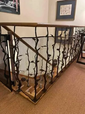 a metal rail with a table in a room at City center, free parking, 4A in Vilnius