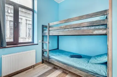 a bunk bed in a room with a window at Sauna 5 bedrooms apartment in old town & Parking in Kaunas
