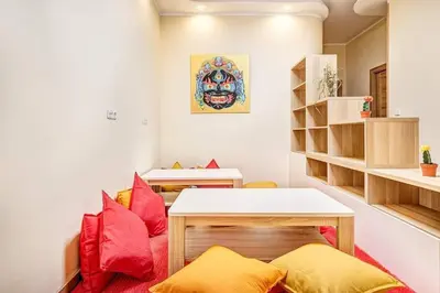 a room with a desk and a table with pillows at Sauna 5 bedrooms apartment in old town & Parking in Kaunas