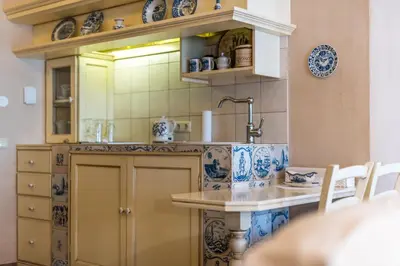 a kitchen with blue and white dishes on the wall at Castle Street Retreat, 19 in Vilnius