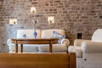a living room with two chairs and a coffee table at Castle Street Retreat, 19 in Vilnius