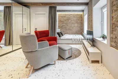 a living room with a bed and a couch at Vilnius city, 17 FREE Street Parking in Vilnius