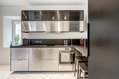 a kitchen with stainless steel cabinets and a stove at Vilnius city, 17 FREE Street Parking in Vilnius