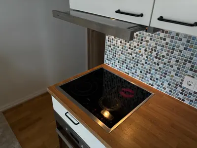 a kitchen with a stove with a counter top at Maslow apartments - Self check in in VNO