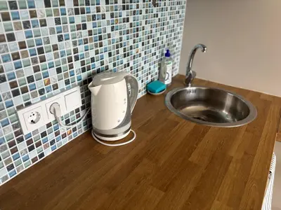a mixer sitting on a counter next to a sink at Maslow apartments - Self check in in VNO