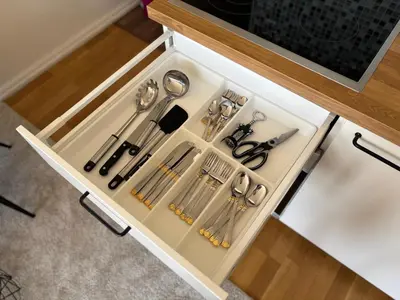 a drawer filled with utensils in a kitchen at Maslow apartments - Self check in in VNO