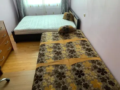 a bedroom with two beds and a quilt at Minties apartment in Vilnius