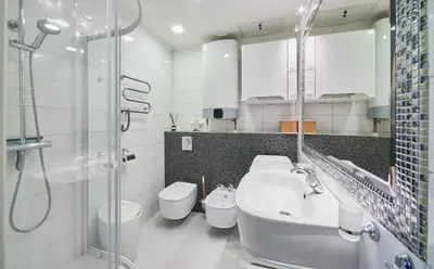 a bathroom with a sink and a toilet and a shower at Old Town Apartment Free parking in Vilnius