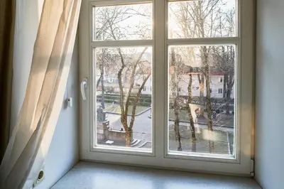 a window with a view of a street at Old Town Apartment Free parking in Vilnius