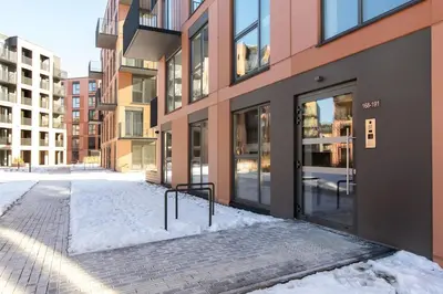an empty street in front of a building at Sunny, Peaceful & Spacious Apartment by URBAN RENT in Vilnius