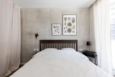 a bedroom with a white bed and a window at Sunny, Peaceful & Spacious Apartment by URBAN RENT in Vilnius