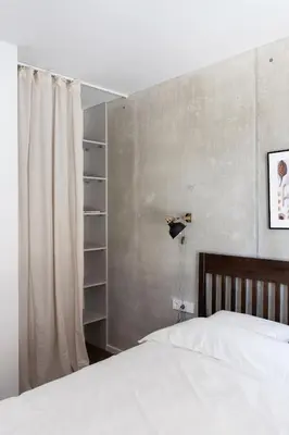 a bedroom with a white bed and a curtain at Sunny, Peaceful & Spacious Apartment by URBAN RENT in Vilnius