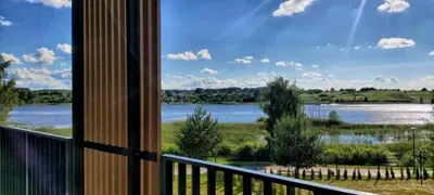 a view of a river from a balcony at Gilužio Apartments in Vilnius