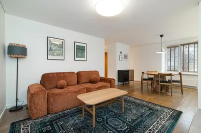 a living room with a couch and a table at Stylish & Comfortable 1-Bedroom Apartment in Vilnius Old Town by URBAN RENT in Vilnius